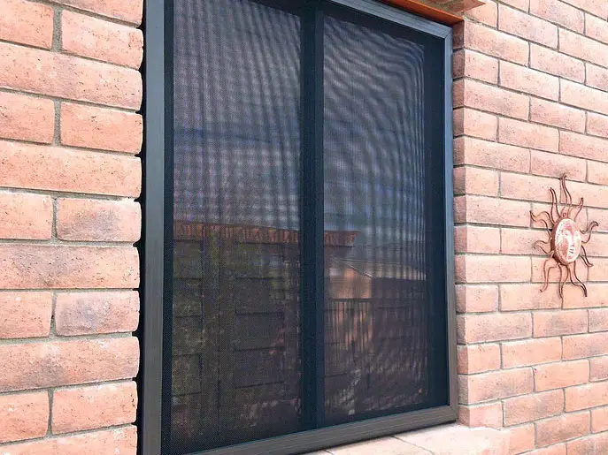 security window screens on a brick home